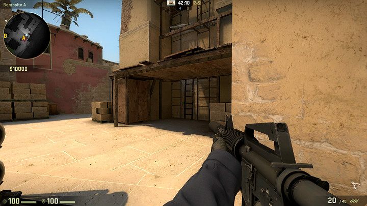 Widok na przestrzeń pod drewnianym podestem gdzie często można spotkać przeciwnika starającego się bronić dostępu do punktu A - Mirage | Mapy turniejowe | CS GO - CS GO - poradnik do gry
