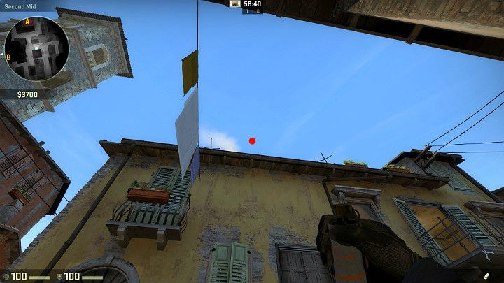 Ustaw się w wyznaczonym miejscu, plecami do ściany i wyceluj w zaznaczony na obrazku punkt - Inferno | Mapy turniejowe | CS GO - CS GO - poradnik do gry
