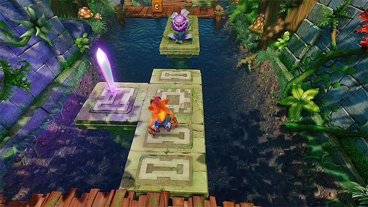 Po dotarciu na suchy ląd dotrzyj do fioletowego kryształu (powyższy obrazek) oraz do nowego checkpointu - Plant Food | Sewer Warp Room | Opis przejścia | Crash Bandicoot N. Sane Trilogy - Crash Bandicoot N. Sane Trilogy - poradnik do gry