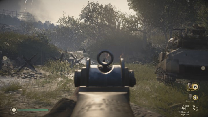Jeden z czołgów strzeli w konstrukcje widoczną na obrazku i otworzy do niej wejście - Call of Duty WW2: Operacja Kobra - Pamiątki, sekrety, znajdźki - Call of Duty: WW2 - poradnik do gry
