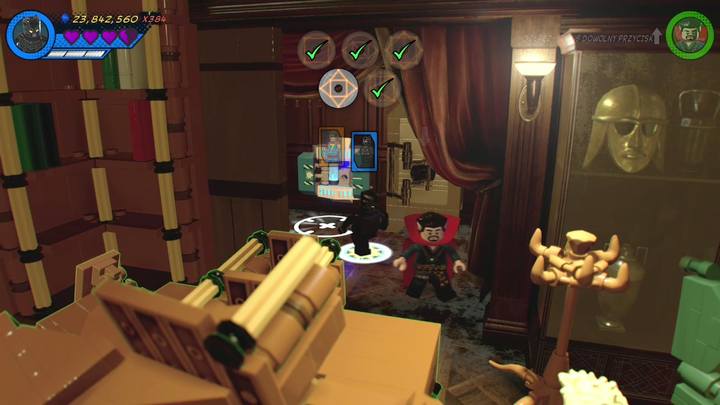 Żeton postaci schowany został w sejfie, znajdującym się za półką z książkami - Sekrety Misja 8 - Po runach do celu | LEGO Marvel Super Heroes 2 - LEGO Marvel Super Heroes 2 - poradnik do gry