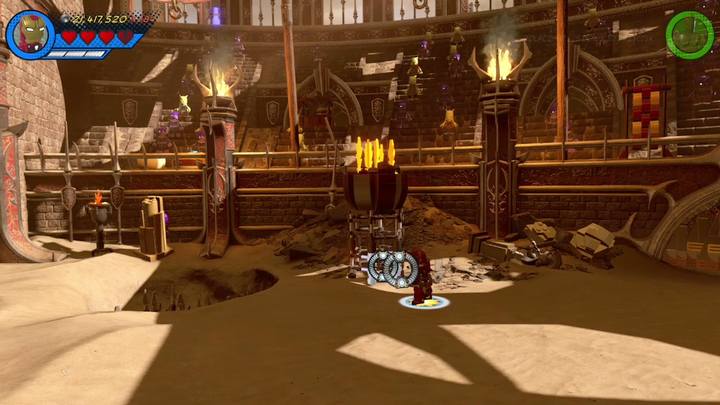 Przejdź na prawą stronę i zniszcz pochodnię korzystając z rakiet Iron Mana - Sekrety Misja 15 - Red King i jego ring | LEGO Marvel Super Heroes 2 - LEGO Marvel Super Heroes 2 - poradnik do gry