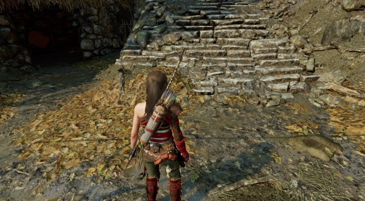 Na północ od obozowiska Village Caves, pod kamiennymi schodami znajdziesz kolejną skrytkę (3) - Skrzynie i skrytki surwiwalowe w Ukrytym Mieście | Sekrety w Tomb Raider - Shadow of the Tomb Raider - poradnik do gry