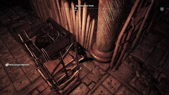 Będziesz musiał przesunąć półkę do drewnianych pali blokujących przejście - Grobowce w Argolis - Assassins Creed Odyssey - poradnik do gry