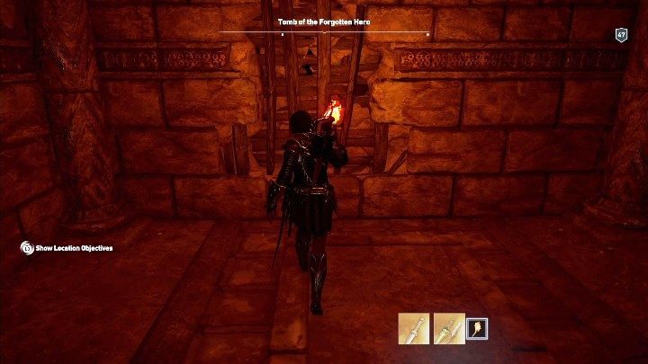 Solucja: Aby wejść do środka grobowca musisz rozbić ścianę zabitą deskami - Grobowce w Lakonii - Assassins Creed Odyssey - poradnik do gry