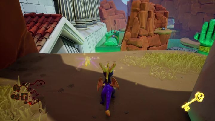Po przejściu przez nią, będziesz mógł poszybować na dłoń znajdującą się po drugiej stronie wąwozu - Pustynne Ruiny - Solucja do Spyro: Year Of The Dragon - Spyro Reignited Trilogy - poradnik do gry