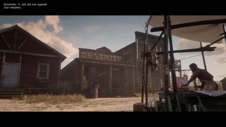 Rusznikarz, a więc sprzedawca broni, ma swój sklep w każdym z większych miast - Amunicja, rusznikarz i katalog podręczny w Red Dead Online - Red Dead Online - poradnik do gry