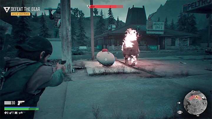 Jeszcze lepszym sposobem na osłabienie niedźwiedzia jest ustawienie się w odległości kilku metrów od pokazanego na obrazku dużego białego zbiornika - Days Gone: Niedźwiedź-boss - jak zabić? - Days Gone - poradnik do gry