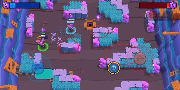 Jeśli chcesz szybko schować się przed atakiem przeciwnika, wbiegnij za skały (zaznaczone na screenie powyżej) - Jak się mogę ukryć w Brawl Stars? - Brawl Stars - poradnik do gry