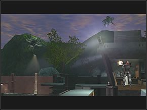 Uważając na wyrzutnie rakiet umieszczoną na wielkim budynku za ścianą uważaj, by wystrzeliwane przez nią rakiety Cię nie dopadły - Complex Exterior | Foreign Lands | Red Faction II - Red Faction II - poradnik do gry