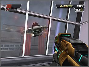 Udaj się najpierw do składziku na prawo, gdzie poza paroma cywilami znajdziesz tak potrzebne naboje - Admin Area | Public Information Building | Red Faction II - Red Faction II - poradnik do gry