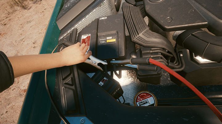 Weź kable z bagażnika i podłącz je do akumulatora samochodu - Cyberpunk 2077: Na rozdrożach/Ghost Town - solucja, opis przejścia - Cyberpunk 2077 - poradnik do gry