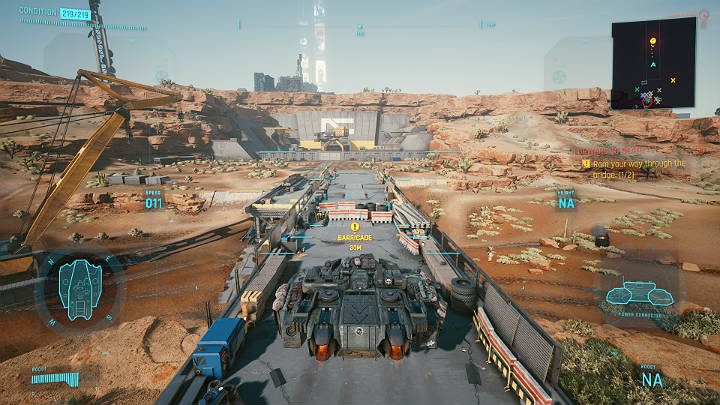 Następnie wleć na wąski most i staranuj panzerem dwie prowizoryczne blokady, by utorować drogę dla Aldecaldos - Cyberpunk 2077: Linia oporu/Forward to Death - solucja, opis przejścia - Cyberpunk 2077 - poradnik do gry