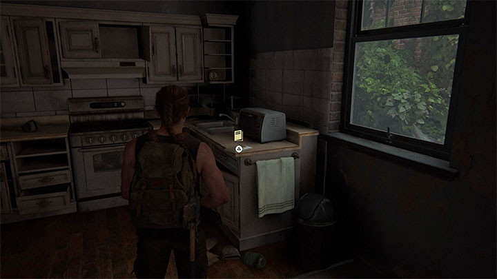 Poszukiwany podręcznik leży w kuchni na blacie - The Last of Us 2: Wrogie terytorium / Hostile Territory sekrety, znajdźki - The Last of Us 2 - poradnik do gry