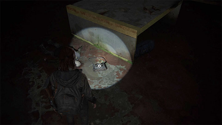 Kombinację do zamka skarbca możesz pozyskać dzięki zbadaniu pokazanej na obrazku torby znajdującej się w tym samym pomieszczeniu - The Last of Us 2: Seattle, dzień 1 Ellie - sejfy, kody - The Last of Us 2 - poradnik do gry