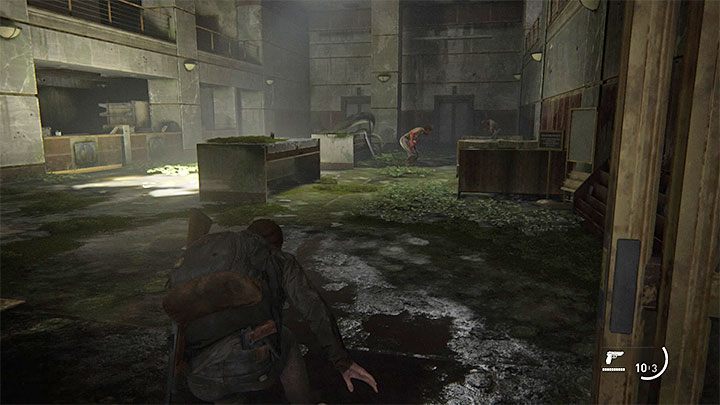Po przeciśnięciu się przez gruzy dotrzecie do zniszczonego lobby banku - The Last of Us 2: Jak zdobyć strzelbę? - The Last of Us 2 - poradnik do gry