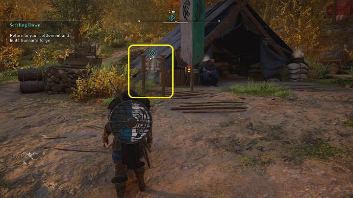 Po powrocie do Ravensthorpe podejdź do drewnianej tabliczki przy stanowisku Gunnara i wejdź z nią w interakcję, a następnie wybuduj kuźnię - Assassins Creed Valhalla: Zapuszczanie korzeni/Settling Down - solucja - Assassins Creed Valhalla - poradnik do gry