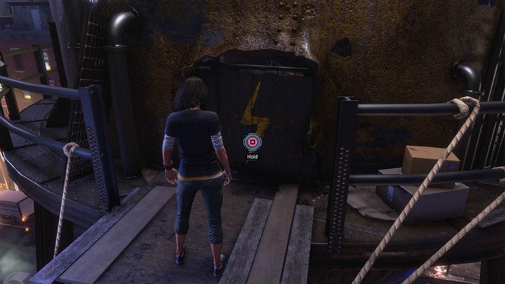 Przeskocz z dachu ostatniego budynku na platformę silosu i odsuń prowizoryczne drzwi, aby wejść do bazy Kamali - Marvels Avengers: Nowa codzienność/New normal - solucja, opis przejścia - Marvels Avengers - poradnik do gry