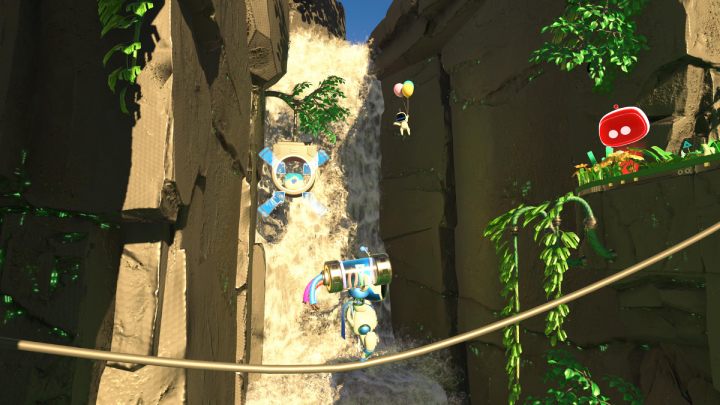 Zanim przejdziesz na drugą stronę, zestrzel pojemnik z monetami oraz bota unoszącego się przy wodospadzie - Astros Playroom: Las renderów - solucja, opis przejścia - Astros Playroom - poradnik do gry