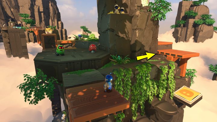 Wskocz po schodach na żółtą trampolinę, która doprowadzi cię do następnego obszaru wyspy - Astros Playroom: Ruiny raytrace - solucja, opis przejścia - Astros Playroom - poradnik do gry