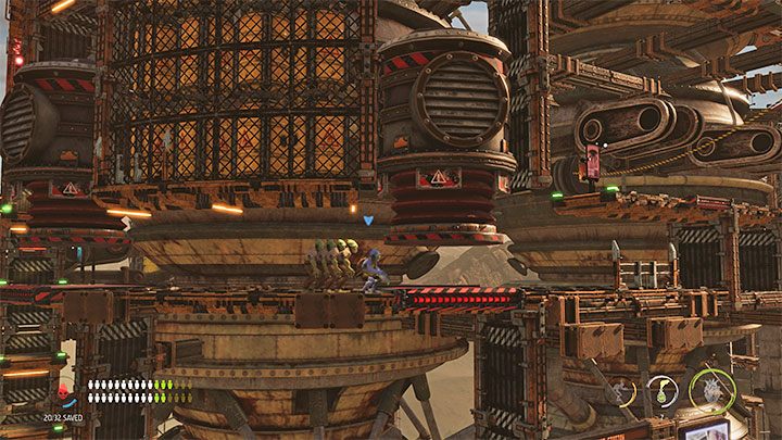 Po raz pierwszy musimy unikać pułapek mogących zmiażdżyć Mudokony - Oddworld Soulstorm: Dotarcie na szczyt Fueling Tower, Phat Station - solucja - Oddworld Soulstorm - poradnik do gry