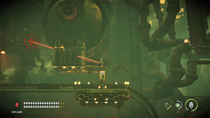 W trakcie przejażdżki musimy namierzać i zabijać atakujące nas Sligi - Oddworld Soulstorm: Dotarcie windą do Comms Tower, Slig Barracks - solucja - Oddworld Soulstorm - poradnik do gry