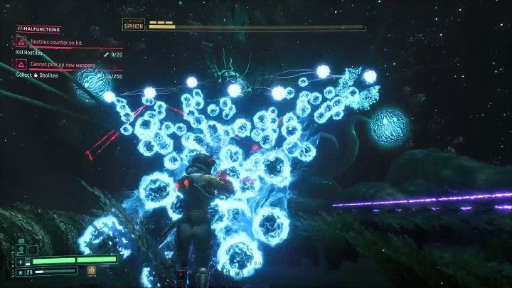 Ophion może także stworzyć chmurę niebieskich kul energii, które lecą z dużą prędkością i z impetem uderzają w podłoże - Returnal: Ophion - boss, jak pokonać? - Returnal - poradnik do gry