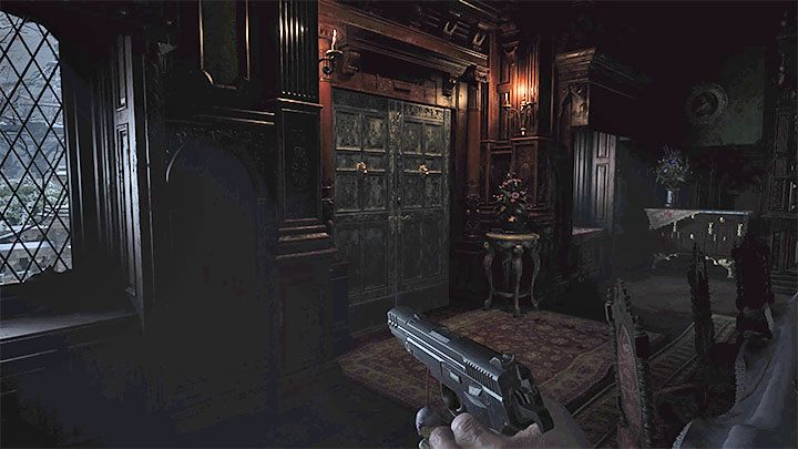 Drzwi prowadzące na dziedziniec Courtyard znajdują się w badanym niedawno pomieszczeniu jadalni Dining Room - Resident Evil Village: Eksploracja zamkowych komnat/Castle Chambers - solucja - Resident Evil Village - poradnik do gry
