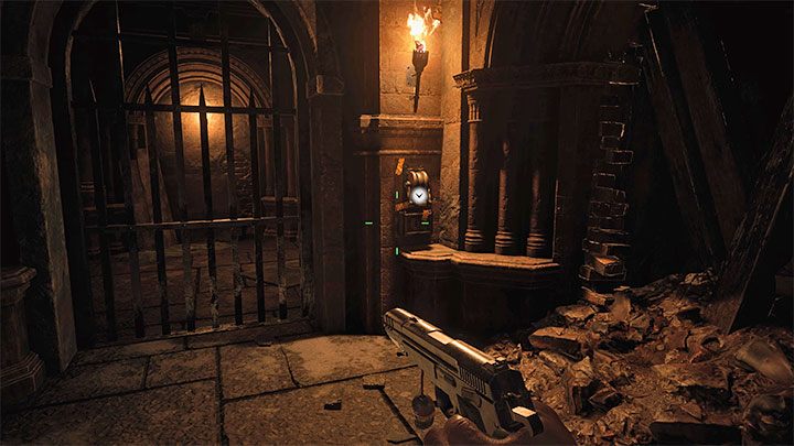 Początkowa przeprawa przez loch Dungeon pozbawiona jest jeszcze ekscytujących momentów, ale sytuacja odmieni się po dotarciu do pokazanej na obrazku drugiej dźwigni - Resident Evil Village: Eksploracja dziedzińca, okolic/Castle Courtyard - solucja - Resident Evil Village - poradnik do gry