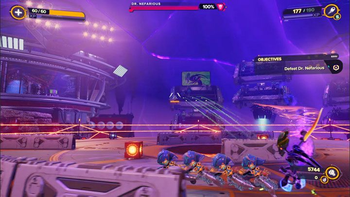 W trakcie pierwszej fazie pojedynku (z czterech) Waszym zadaniem będzie doprowadzenie do obniżenia paska zdrowia ze 100 do 80% - Ratchet & Clank Rift Apart: Doktor Nefarious, Arena, powrót - jak pokonać? - Ratchet & Clank Rift Apart - poradnik do gry