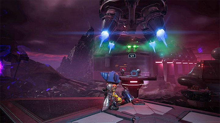 Dotrzyjcie do dużej konsoli po to żeby wejść z nią w interakcję - Ratchet & Clank Rift Apart: Odnalezienie Ratcheta i Kit - solucja - Ratchet & Clank Rift Apart - poradnik do gry