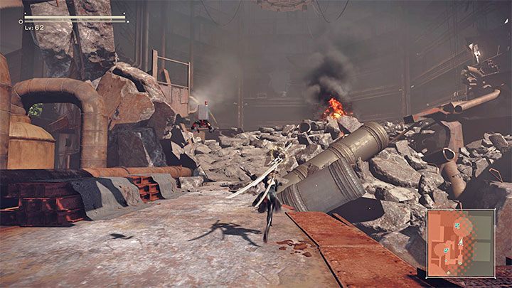 Badajcie nową okolicę po to żeby dotrzeć do zgliszcz ściany jednego z budynków fabryki - NieR Automata: Bunkier - solucja, misje poboczne - NieR Automata - poradnik do gry