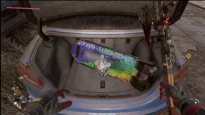 Ostatecznie dotrzecie do niebieskiego auta, w którym możecie otworzyć bagażnik - Dying Light 2: Deskolotka (Easter egg) -gdzie znaleźć? - Dying Light 2 - poradnik do gry
