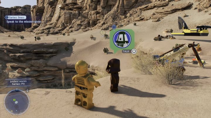 Sterując postacią droida protokolarnego porozmawiajcie ze zleceniodawcą na pustyni Jundlandii - LEGO Skywalker Saga: Smakołyki dla sarlacca (Sarlacc Snacc) - solucja, opis przejścia - LEGO Skywalker Saga - poradnik do gry