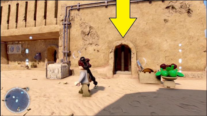 Klocek położony dokładnie w centrum mapy schowany jest w pomieszczeniu za metalowymi kratami - LEGO Star Wars The Skywalker Saga: Mos Eisley - lista wszystkich łamigłówek - LEGO Skywalker Saga - poradnik do gry