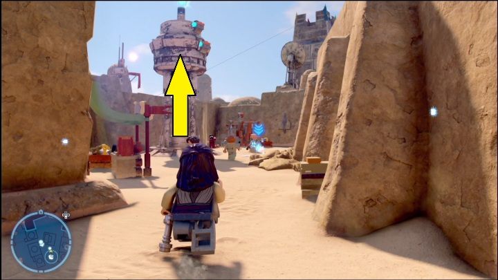 Kolejny klocek leży na szczycie wieży, dostaniecie się do niego korzystając z postaci z hakiem (droid astromechaniczny bądź łowca nagród) - LEGO Star Wars The Skywalker Saga: Mos Eisley - lista wszystkich łamigłówek - LEGO Skywalker Saga - poradnik do gry