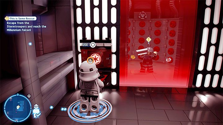 Mając założone przebranie wyruszcie sąsiednimi korytarzami do pokazanej na obrazku czerwonej konsoli - LEGO Skywalker Saga: Też mi ratunek (This is Some Rescue) - solucja, opis przejścia - LEGO Skywalker Saga - poradnik do gry