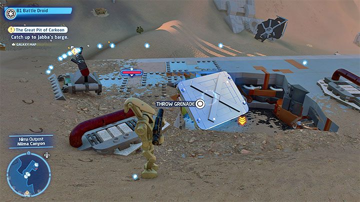 Przełączcie się na dowolną postać z klasy Złoczyńców i zlokalizujcie pokazany na obrazku srebrny obiekt - LEGO Skywalker Saga: Osada Niima (Niima Outpost) - lista wszystkich łamigłówek - LEGO Skywalker Saga - poradnik do gry