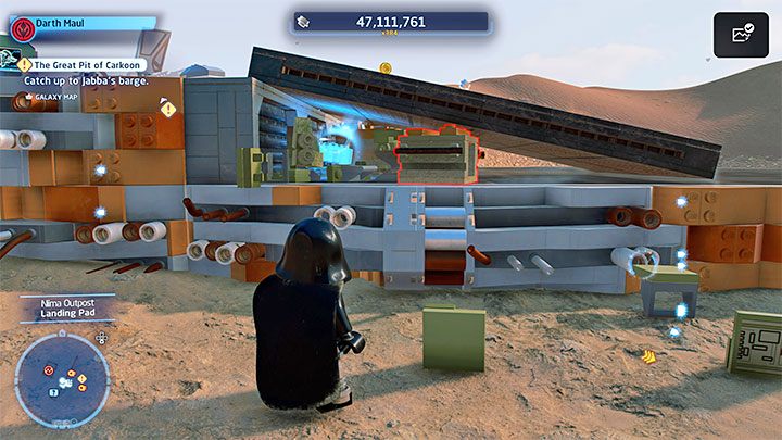 Zniszczcie klocki pod rampą lądowiska, a odsłonicie pokazany na obrazku sekret - LEGO Skywalker Saga: Osada Niima (Niima Outpost) - lista wszystkich łamigłówek - LEGO Skywalker Saga - poradnik do gry