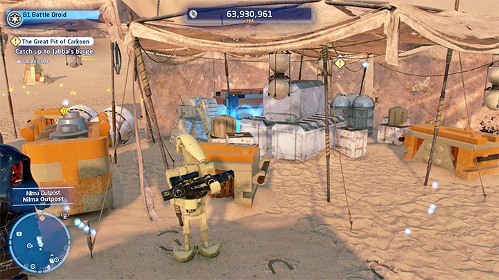 Znajdźkę ukryto za skrzynkami z powyższego obrazka - LEGO Skywalker Saga: Osada Niima (Niima Outpost) - lista wszystkich łamigłówek - LEGO Skywalker Saga - poradnik do gry