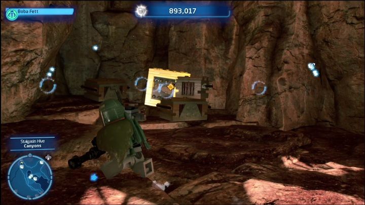 Klocek zamknięty jest w złotej skrzyni, którą mogą zniszczyć jedynie pociski z broni Łowcy Nagród - LEGO Skywalker Saga: Ul Stalgasin - lista wszystkich łamigłówek - LEGO Skywalker Saga - poradnik do gry