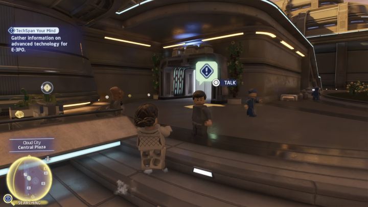 Idźcie za wyznacznikiem do obszaru poszukiwań i porozmawiajcie z mężczyzną przy schodach, niedaleko ogromnej fontanny - LEGO Skywalker Saga: Technologiczny test (TechSpan Your Mind) - solucja, opis przejścia - LEGO Skywalker Saga - poradnik do gry