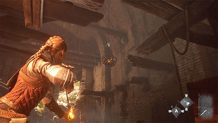 Kolejnym Igniferem musicie wycelować w wiszący kosz z dołączonego obrazka - Plague Tale Requiem: Wydostanie się z podziemi areny (Exit the arenas underground) - solucja, opis przejścia - A Plague Tale Requiem - poradnik do gry