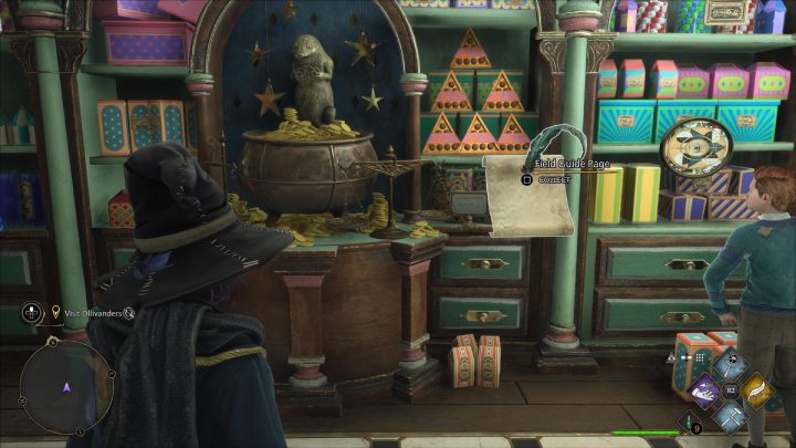 Jedna ze stron Revelio jest przy trójkątnych pudełkach z czekoladkami, obok posągu Nifflera - Hogwarts Legacy: Strony przewodnika (Field Guide Pages) część 2 - Hogsmeade - Hogwarts Legacy - poradnik do gry