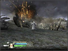 Posuwając się naprzód trzaskaj do wózków z prochem, leżących pod drewnianymi konstrukcjami - The road to Isengard (2) - Droga Gandalfa Białego - Władca Pierścieni: Powrót Króla - poradnik do gry