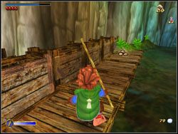 Twoim zadaniem jest obniżenie poziomu w rzece, co uczynisz opuszczając wajchę na drewnianym mostku - 02 - Roast Mutton | The Hobbit - The Hobbit - poradnik do gry