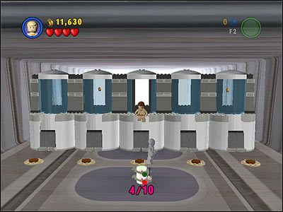 W tym samym pomieszczeniu, w którym znalazłeś #3, strzel w widoczną w głębi ekranu tarczę i podejdź do pojemników - [E2] Chapter 1 - Kanistry 1-4 - LEGO Star Wars - poradnik do gry