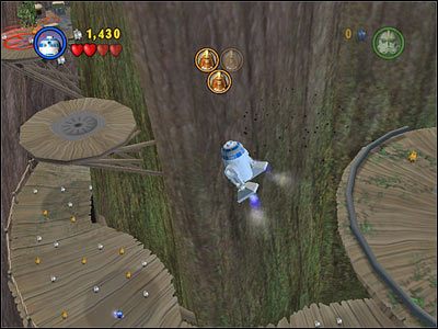 Użyj R2, by przelecieć z platformy, na której uwolniłeś pierwszego Wookiego w lewo, a następnie doskocz Jar-Jarem do kanistra - [E3] Chapter 4 - Kanistry 1-3 - LEGO Star Wars - poradnik do gry