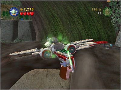 Użyj Mocy na zatopionym w bagnie myśliwcu, po czym szybko przełącz się na Jar-Jara i wskocz na kabinę pilota - [E3] Chapter 4 - Kanistry 4-7 - LEGO Star Wars - poradnik do gry