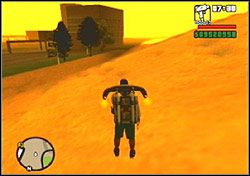 Czeka cię jeszcze zejście na dno szybu w asyście wściekle strzelających żołnierzy i oto sekret Strefy 69 stoi przed tobą - błyszczący chromem plecak odrzutowy (Jet Pack) - GTA San Andreas: Air Yard (znaczek samolotu) - Aktywa - GTA San Andreas - poradnik do gry